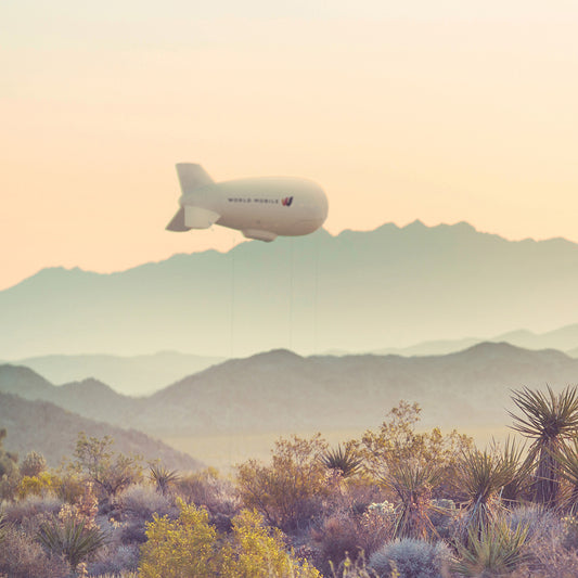 World Mobile Aerostat 4K Desert Wallpaper